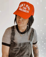 Load image into Gallery viewer, Don’t Wake The Dreamers Trucker Hat - Orange
